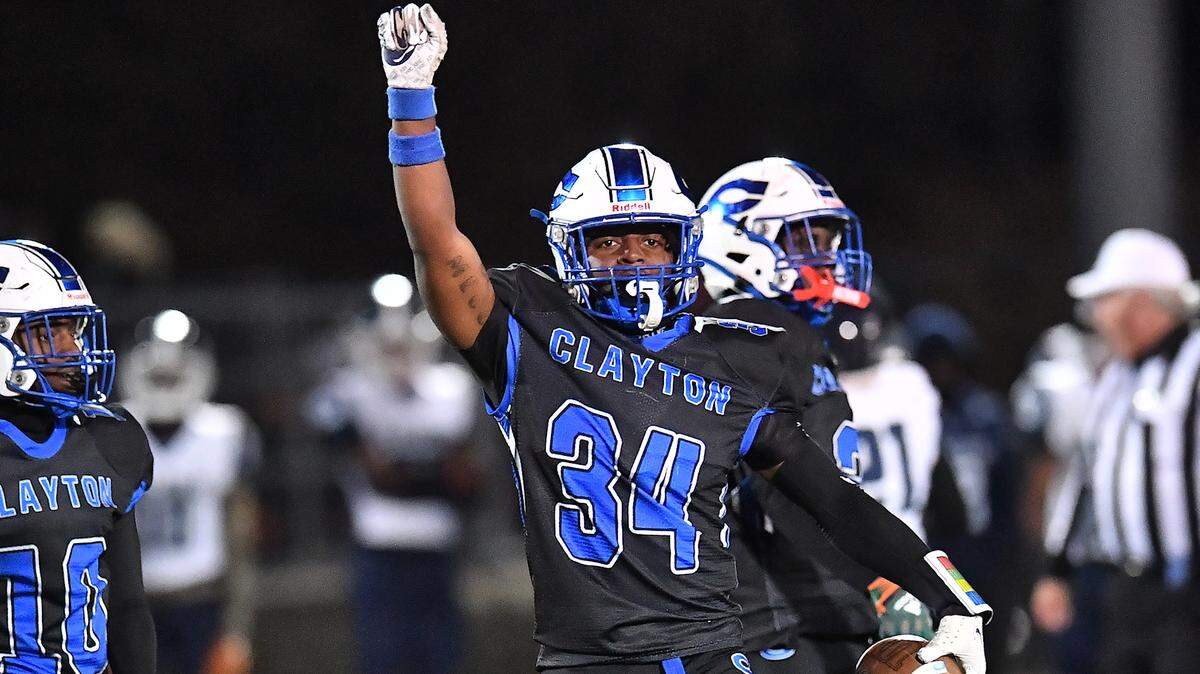 Clayton linebacker Imari Givens (34) reacts after the turnover on downs by Southeast Raleigh during the second half. The Clayton Comets and the Southeast Raleigh Bulldogs met in the fourth round of the NCHSAA 7A Playoffs in Clayton, N.C. on November 28, 2025.