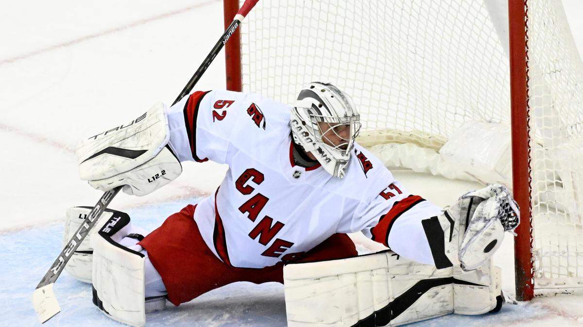 Carolina Hurricanes goaltender Pyotr Kochetkov (52) gloves the puck during the third period of an NHL hockey game against the New Jersey Devils Saturday, April 23, 2022, in Newark, N.J. (AP Photo/Bill Kostroun)