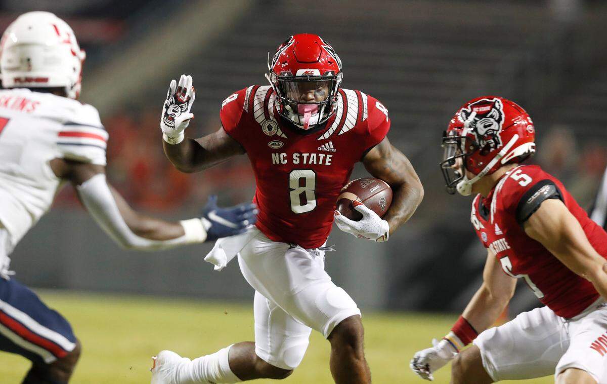 N.C. State’s Ricky Person Jr. (8) looks for running room during the first half of N.C. State’s game against Liberty at Carter-Finley Stadium in Raleigh, N.C., Saturday, Nov. 21, 2020.