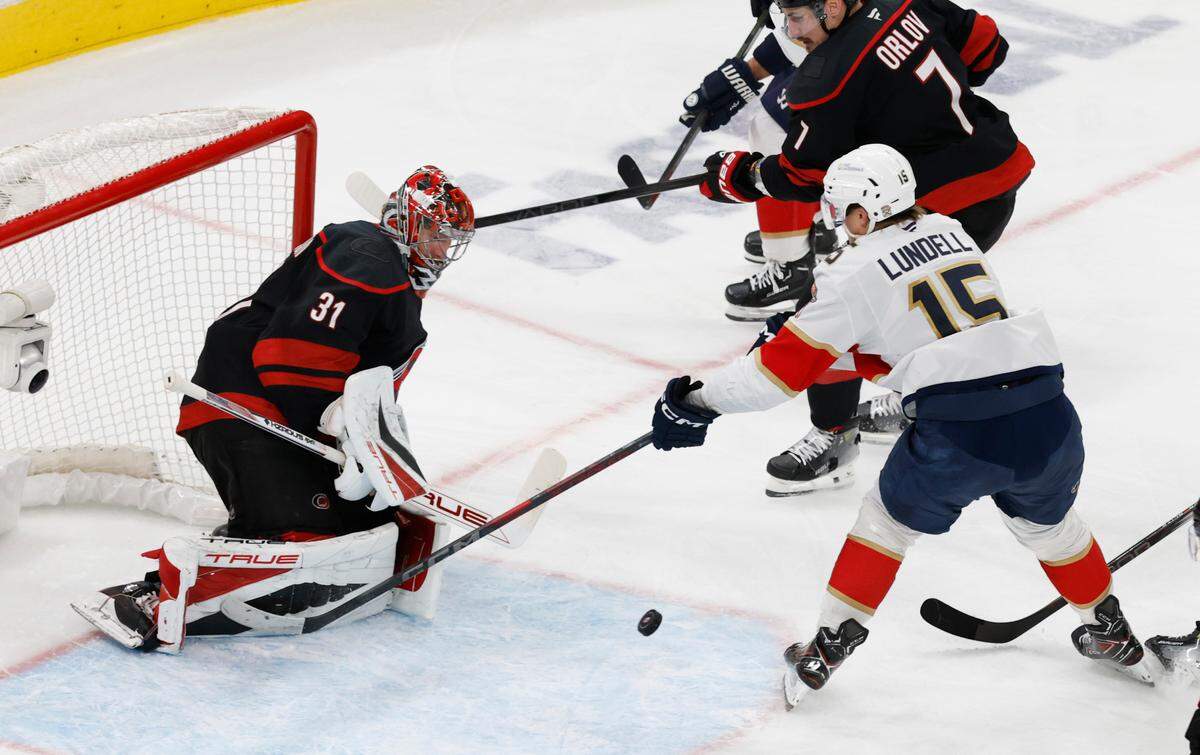 Carolina’s Frederik Andersen (31) keeps his eyes on the puck as Panthers’ Anton Lundell (15) can’t score during the second period of the Carolina Hurricanes’ game against the Florida Panthers in Game 2 of the Eastern Conference Final at the Lenovo Center in Raleigh, N.C., Thursday, May 22, 2025.