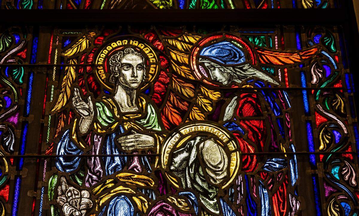 A detail of a stained-glass window inside the Holy Name of Jesus Cathedral in Raleigh on Friday, May 24, 2024.