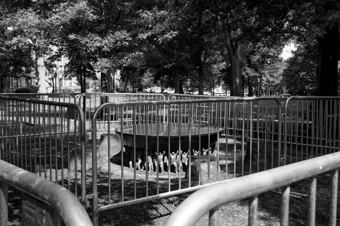 The Unsung Founders Memorial, a memorial to honor the free and enslaved Black people who built The University of North Carolina at Chapel Hill, was surrounded by barricades several weeks after white supremacists gathered at the memorial and sat on it with Confederate flags.