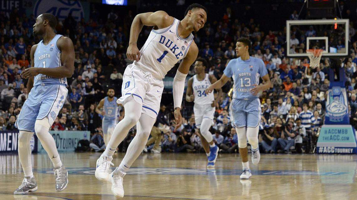 Duke's Trevon Duval (1) grimaces in pain after being injured in the first half.