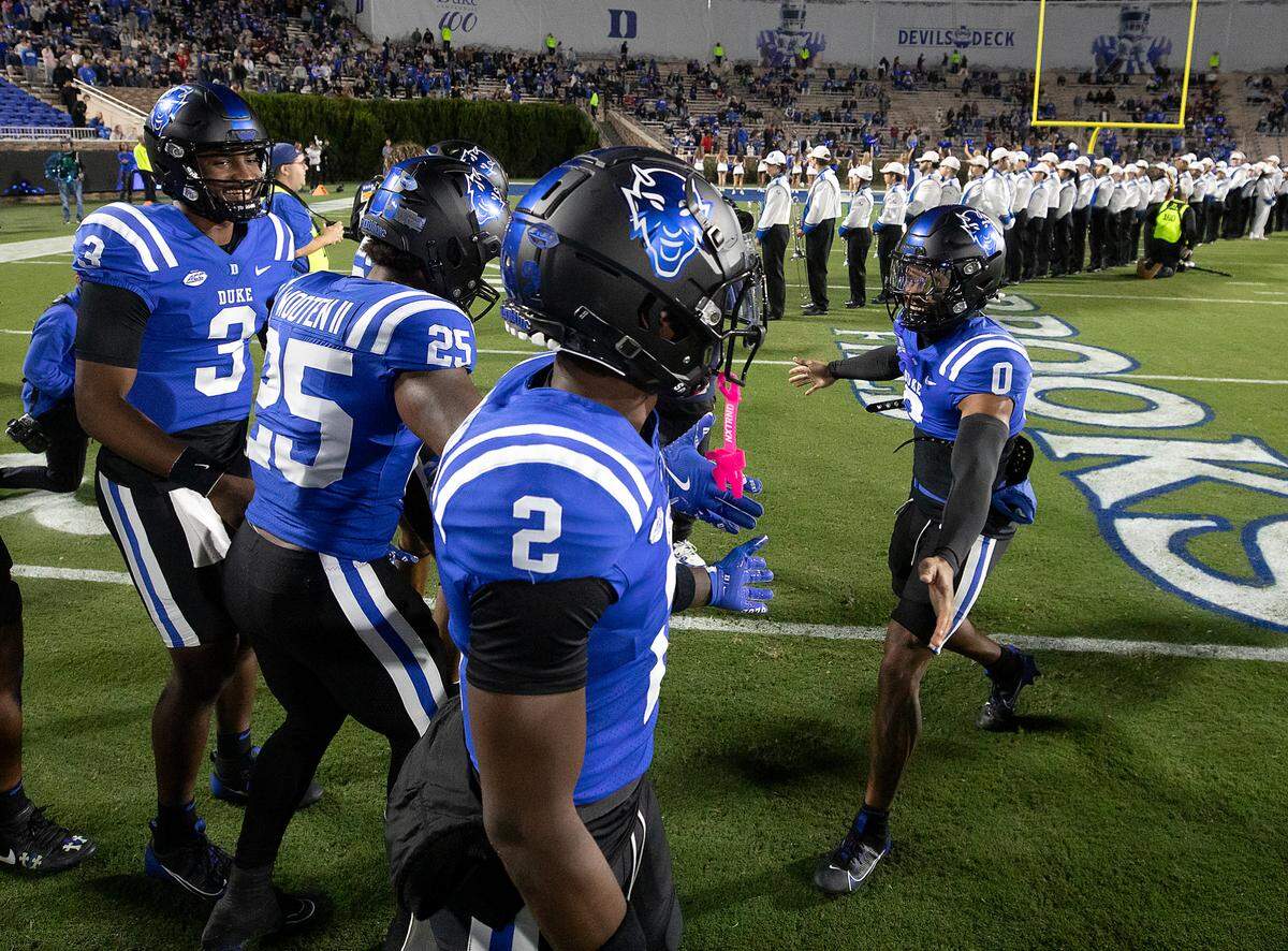 Duke’s Chandler Rivers (0) is greeted by teammates after being introduced prior to the Blue Devils’ game against Florida State on Friday, Oct. 18, 2024, at Wallace Wade Stadium in Durham, N.C.