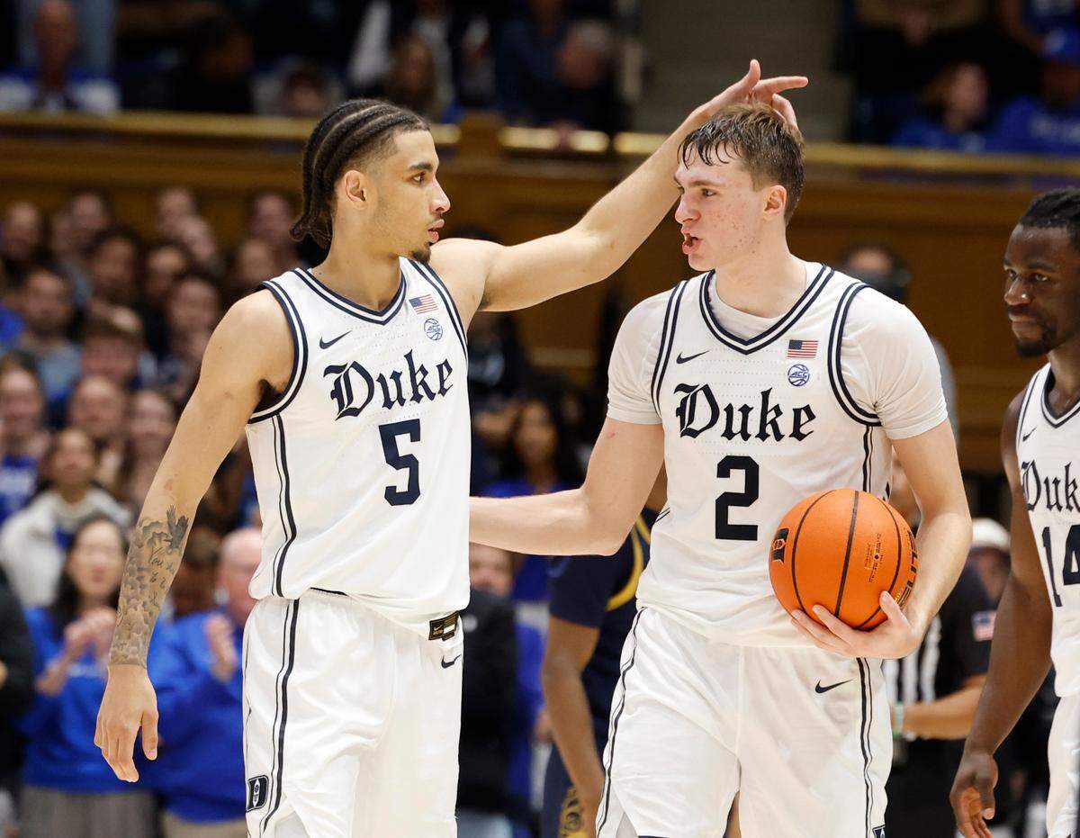 Duke’s Cooper Flagg (2) celebrates with Tyrese Proctor (5) near the end of Duke’s 86-78 victory over Notre Dame at Cameron Indoor Stadium in Durham, N.C., Saturday, Jan. 11, 2025.