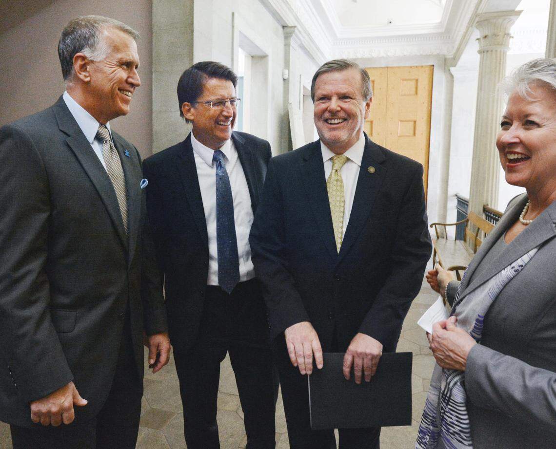 From left: Speaker of the House Thom Tillis, Gov. Pat McCrory, President Pro Tempore of the Senate Phil Berger and Sec. of Commerce Sharon Decker are all smiles following a press conference to announce a tax deal in July 2013.