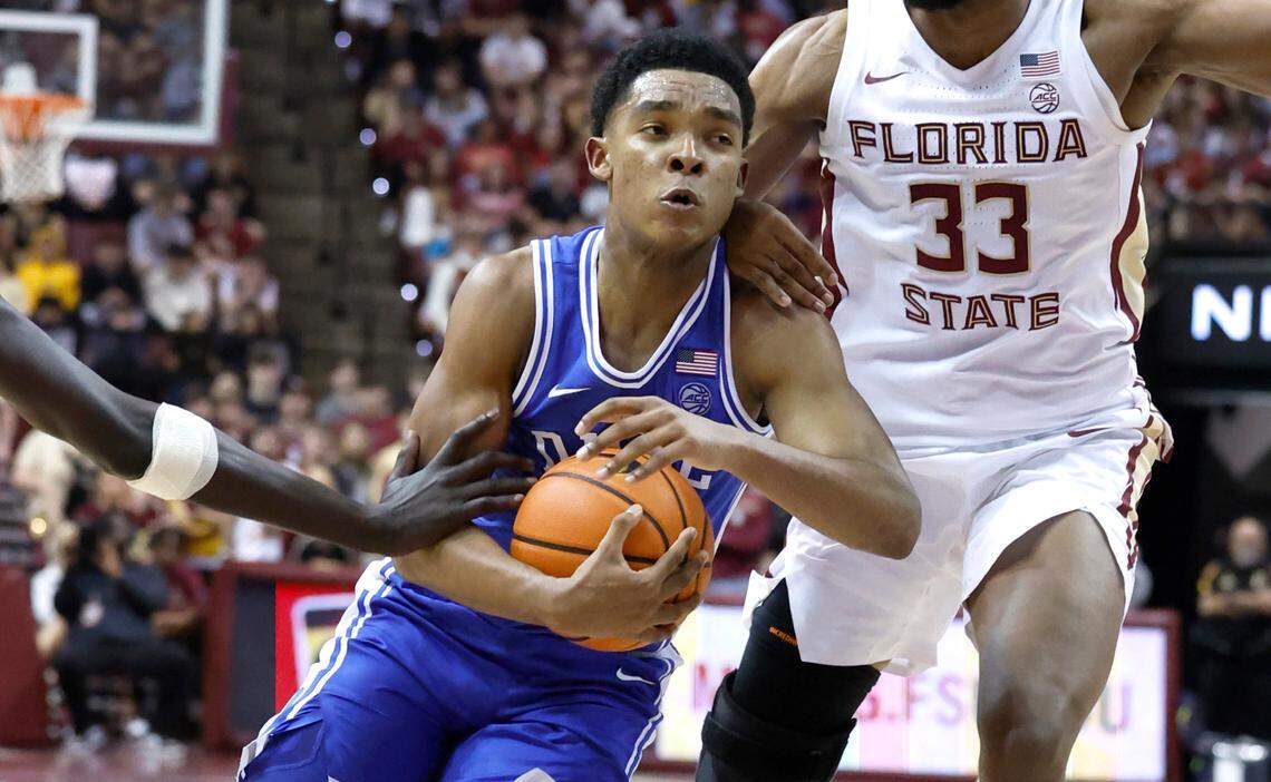 Duke’s Caleb Foster (1) drives by Florida State’s Taylor Bol Bowen (10), left, and Jaylan Gainey (33) during the first half of Duke’s game against Florida State University at the Tucker Center in Tallahassee, Fla. Sat. February 17, 2024.