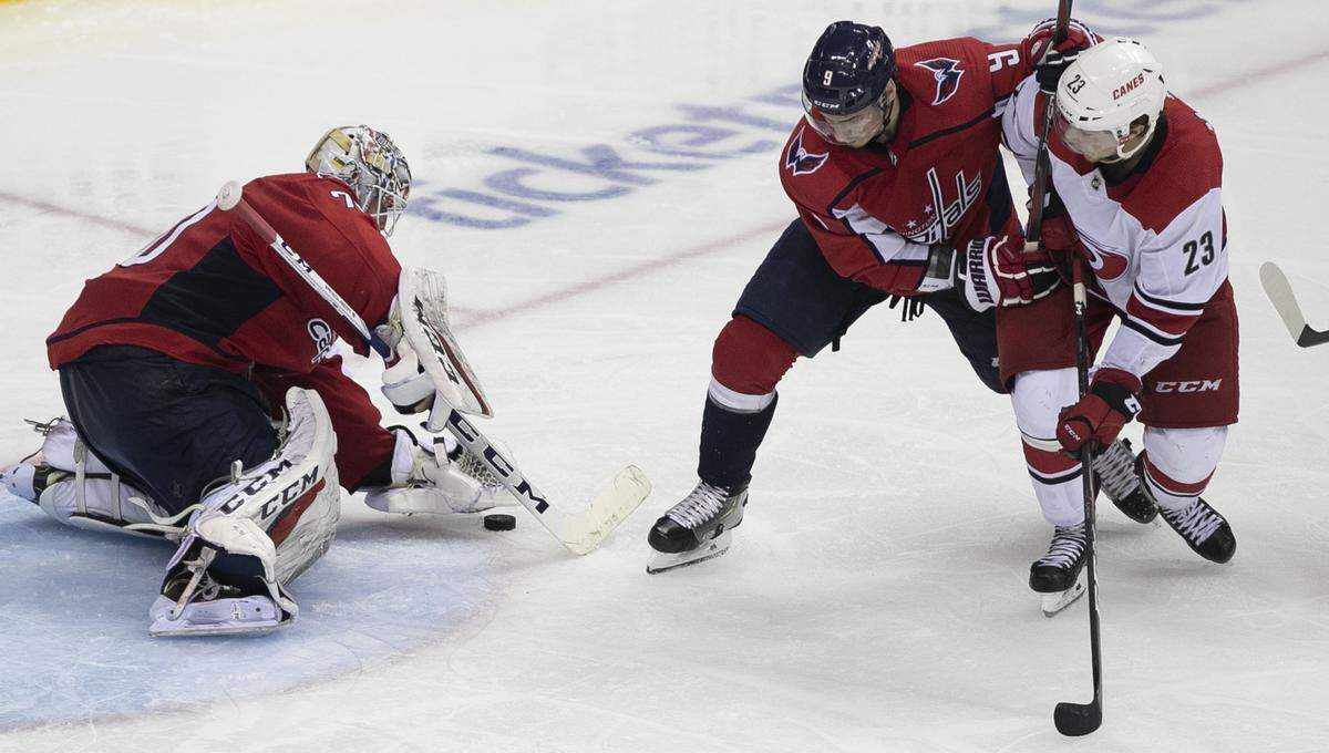 Carolina Hurricanes’ Brock McGinn (23) tries to score on Washington Capitals’ goalie Braden Holtby (70) in the first overtime period during Game 7 of their first round Stanley Cup series on Wednesday, April 24, 2019 at Capital One Arena in Washington, D.C