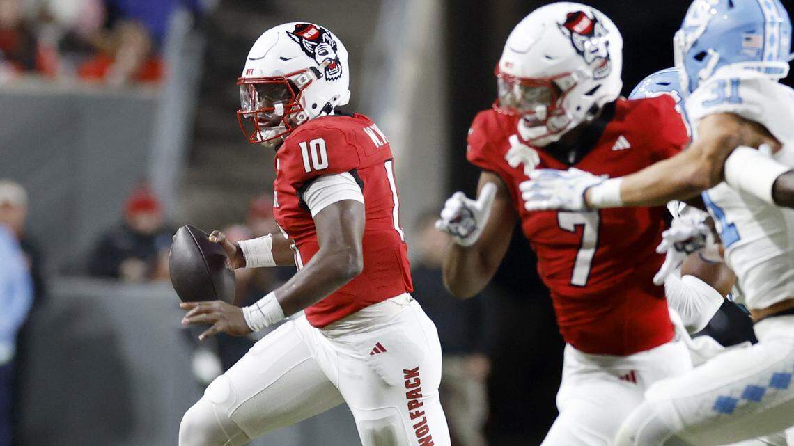 N.C. State quarterback Will Wilson (10) gains yards during the first half of N.C. State’s game against UNC at Carter-Finley Stadium in Raleigh, N.C., Saturday, Nov. 29, 2025.