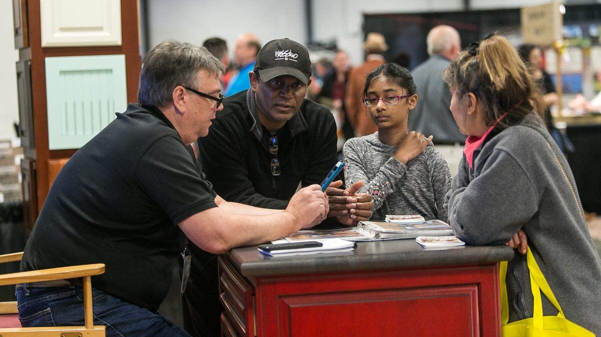 Attendees consult with a home specialist at the 2019 Fairgrounds Southern Ideal Home Show in Raleigh.