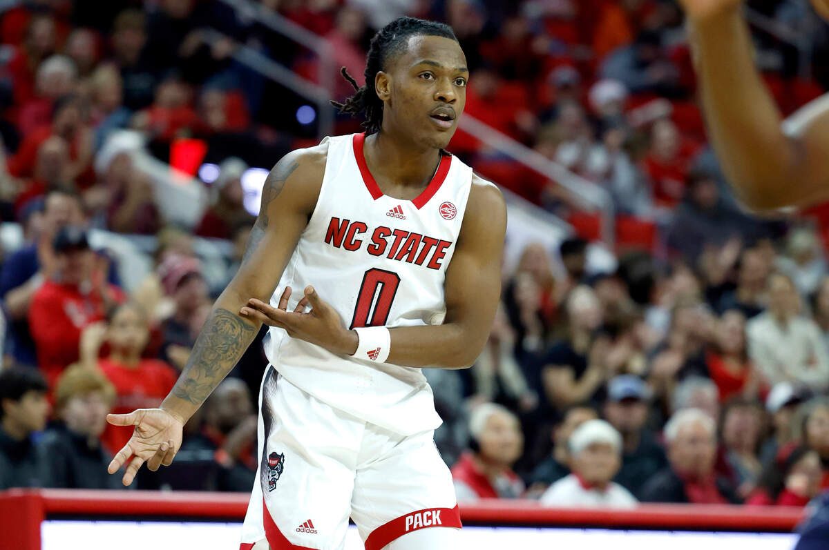 N.C. State’s DJ Horne (0) celebrates after hitting a three-pointer during the second half of N.C. State’s 81-67 victory over UT Martin at PNC Arena in Raleigh, N.C., Tuesday, Dec. 12, 2023.