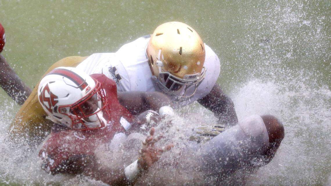 N.C. State running back Matt Dayes (21) slides on the ground after being tackled by Notre Dame linebacker Te’von Coney (4) during the second half of N.C. State’s 10-3 victory over Notre Dame at Carter-Finley Stadium in Raleigh, N.C., Saturday, Oct. 8, 2016.