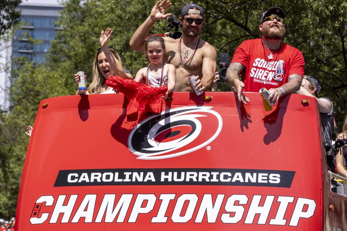 Thousands of Carolina Hurricanes fans gather in downtown Raleigh on Saturday, June 20, 2026, during a parade and rally celebrating the Hurricanes' Stanley Cup Final victory over the Vegas Golden Knights. The Hurricanes won the series 4-2 to capture the Stanley Cup for the second time since 2006.