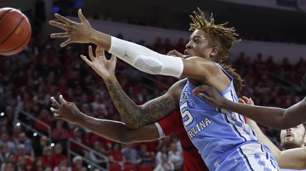 North Carolina’s Armando Bacot (5) goes after a rebound with N.C. State’s Manny Bates (15) during the first half of N.C. State’s game against UNC at PNC Arena in Raleigh, N.C., Monday, Jan. 27, 2020.