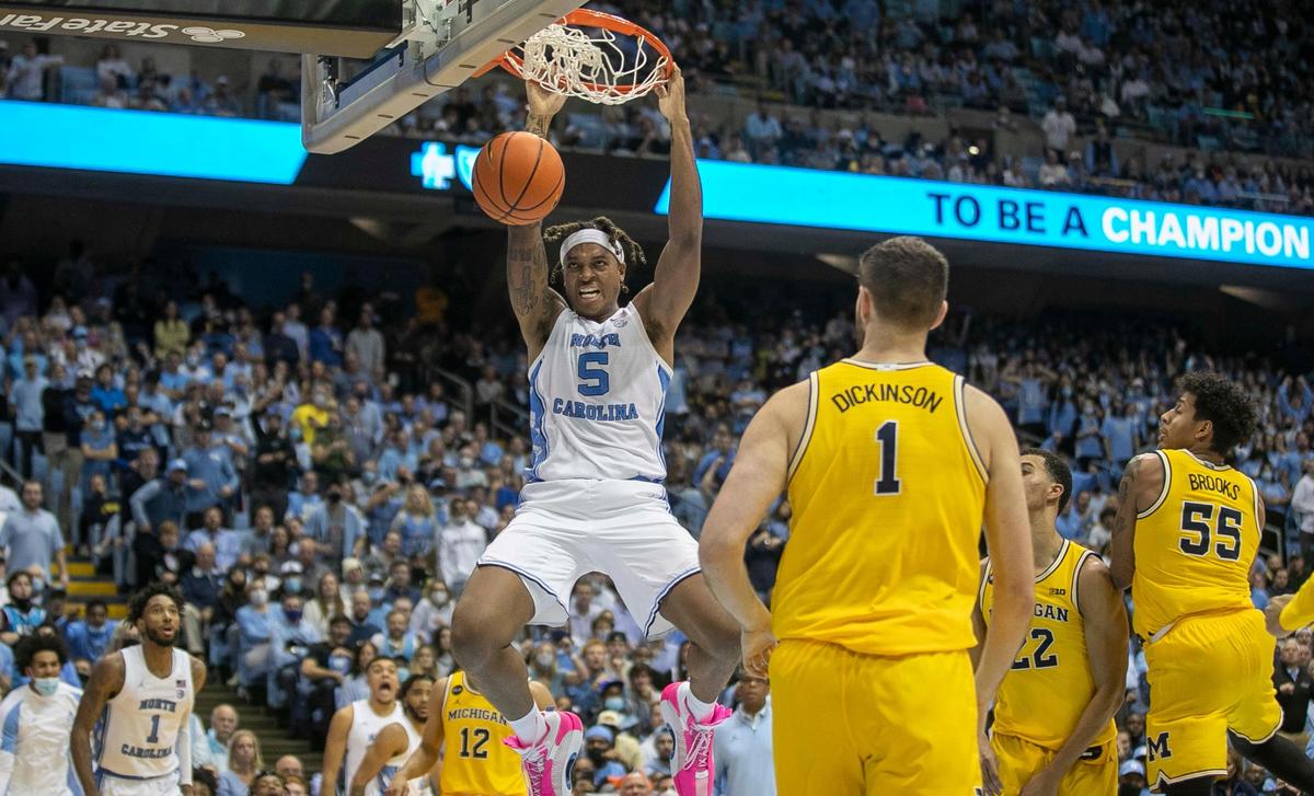 North Carolina’s Armando Bacot (5) gets a dunk during the second half against Michigan on Wednesday, December 1, 2021 at the Smith Center in Chapel Hill, N.C. Bacot scored 11 points in the Tar Heels’ 72-51 victory.