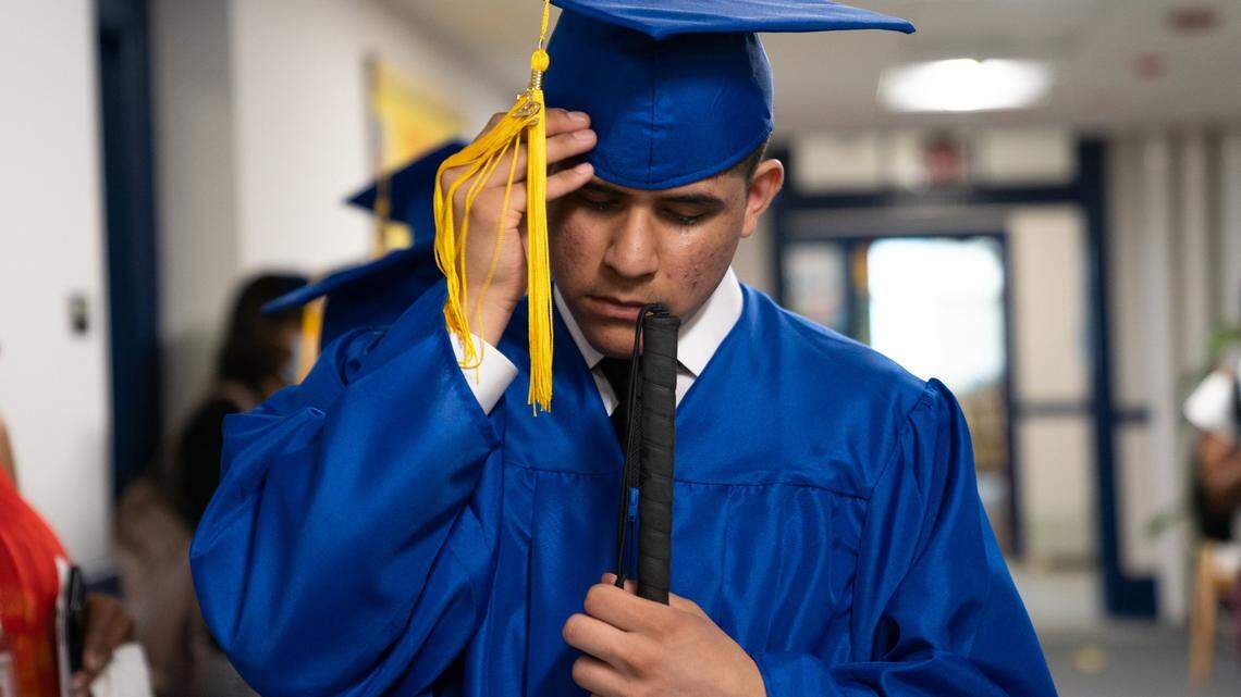 Class of 2022 Graduate Angel Alvarez-Rangel from Greensboro, N.C. adjusts his cap moments before the Commencement Ceremony begins at the Governor Morehead School in Lineberry Hall in Raleigh, N.C. on Friday, June 3, 2022. Students such as Alvarez-Rangel come from across the state to the school for its education services for the deaf and visually impaired.