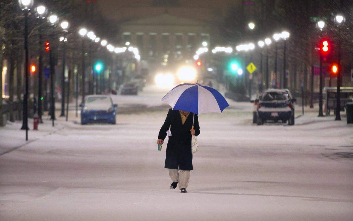 Dean Webster makes his way up Fayetteville Street to his office after a visit to the Subway for some dinnern on Wednesday night February 12, 2014 in Raleigh, N.C. “It was like an oasis”, Webster said, referring to the restaurant that was open despite the winter storm. Webster said he was prepared to spend the night in his downtown office instead of trying to make to his home off of Glenwood Avenue.