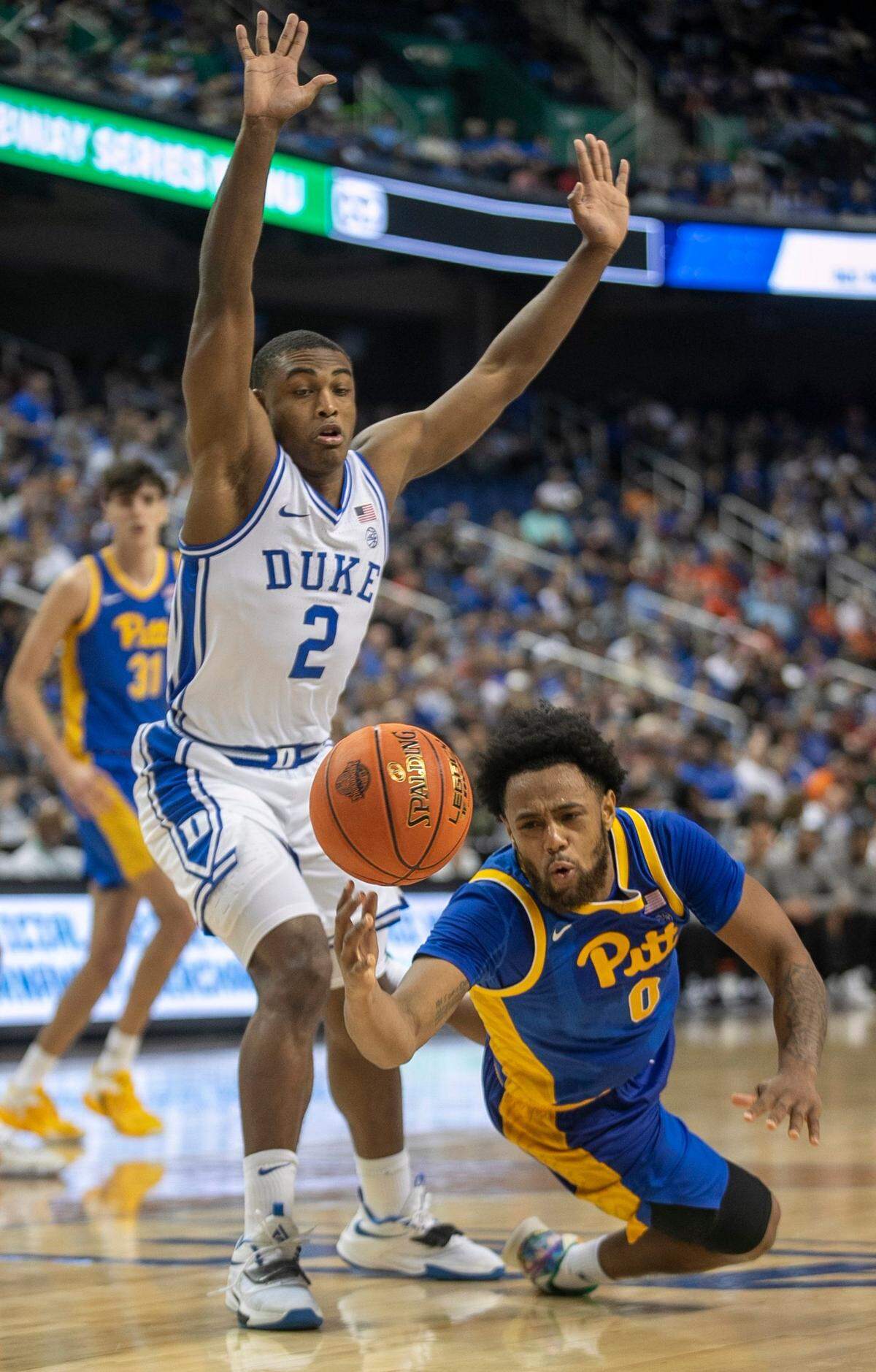 Pittsburgh’s Nelly Cummings (0) looses control of the ball under Duke’s Jaylen Blakes (2) in the second half during the third round of the ACC Tournament on Thursday, March 9, 2023 at the Greensboro Coliseum in Greensboro, N.C.