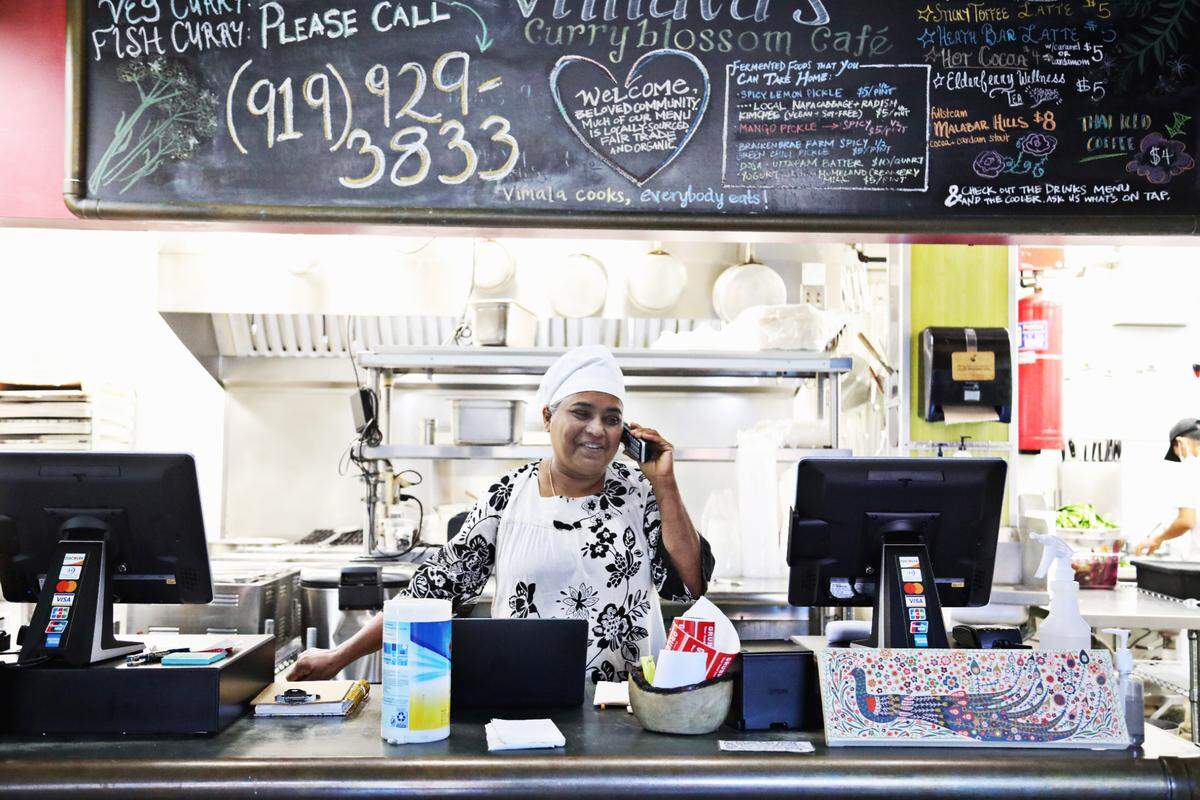 Vimala Rajendran, the owner of Chapel Hill restaurant, VimalaÕs Curryblossom Cafe, takes a call Wednesday morning Oct. 7, 2020. Rajendran is not making enough from takeout and says her restaurant is bringing in only about 25% of its pre-pandemic revenue.