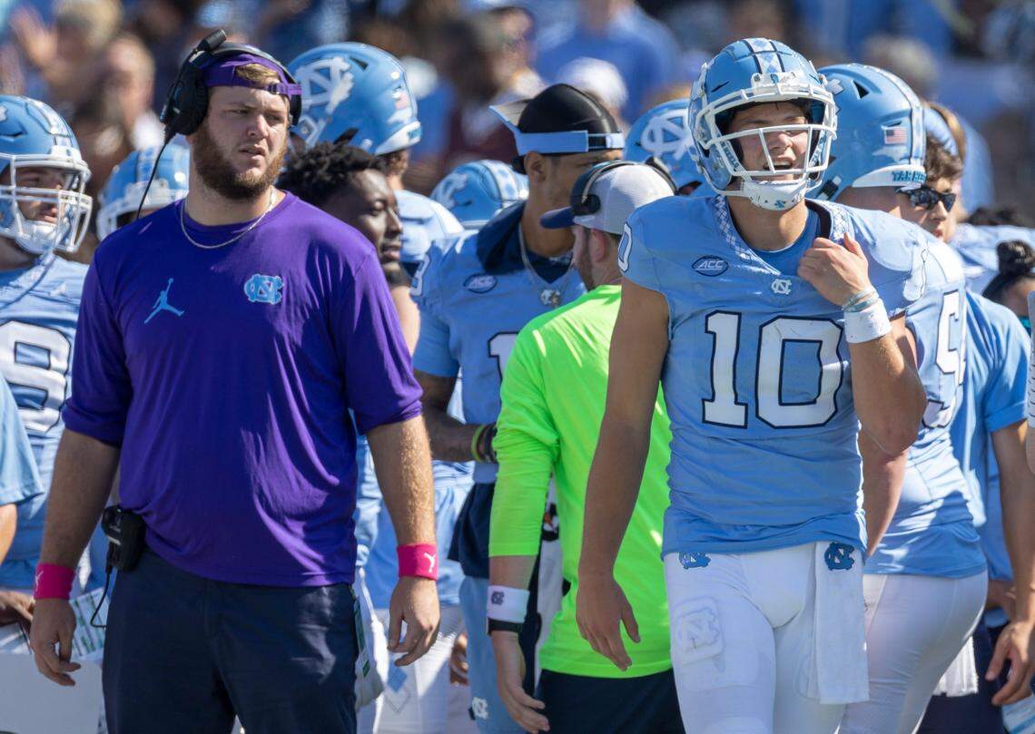 North Carolina quarterback Drake Maye (10) holds his left shoulder after taking a hit in the first quarter against Minnesota on Saturday, September 16, 2023 at Kenan Stadium in Chapel Hill N.C.