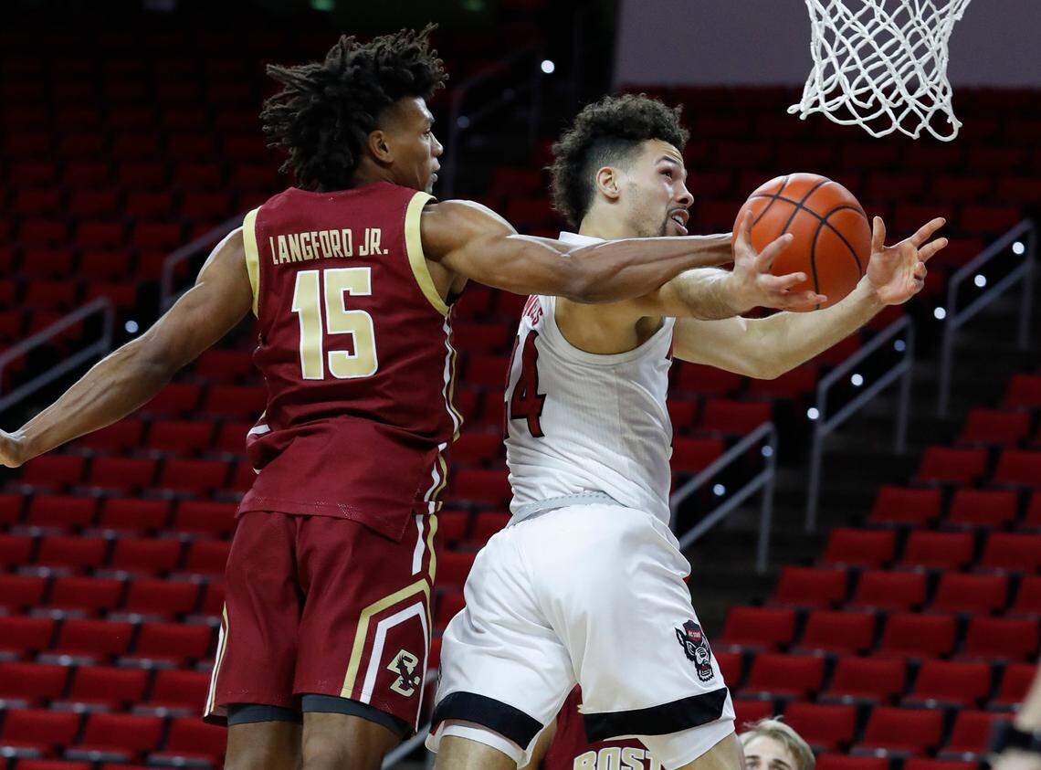 N.C. State’s Devon Daniels (24) is fouled by Boston College’s Demarr Langford Jr. (15) during the second half of N.C. State’s 79-76 victory over Boston College at PNC Arena in Raleigh, N.C., Wednesday, December 30, 2020.