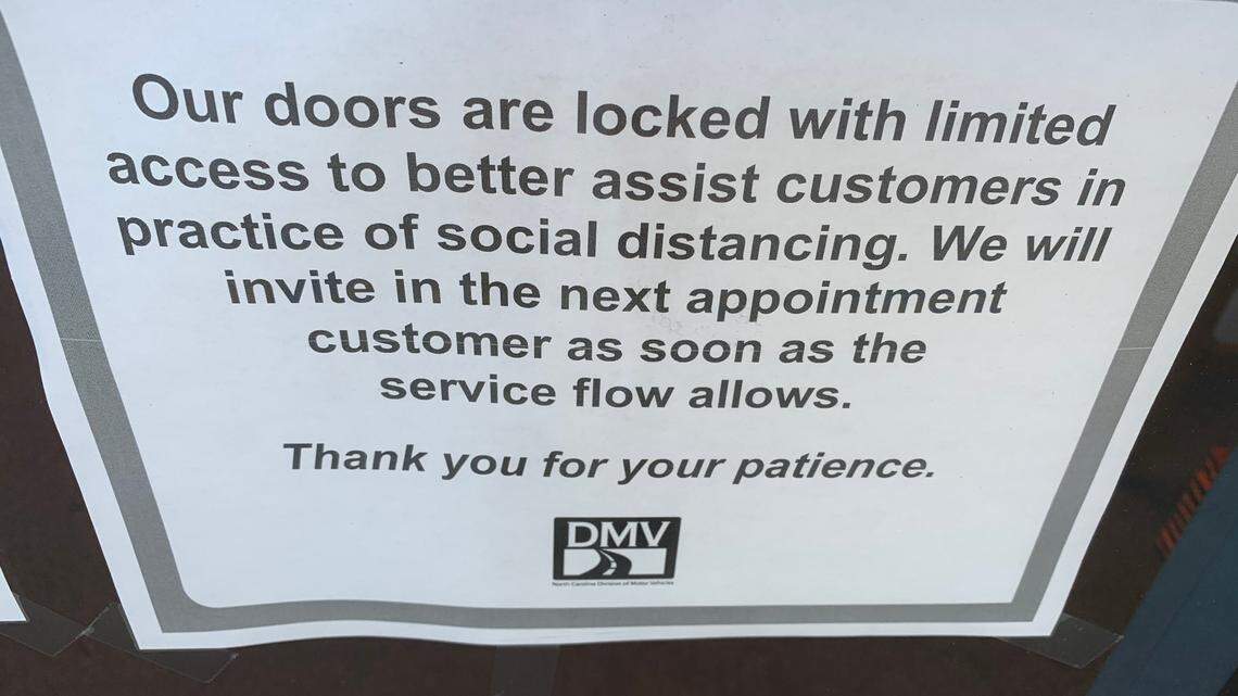 A sign on the door of the Division of Motor Vehicles driver’s license office on Avent Ferry Road in Raleigh. The DMV is seeing customers by appointment only at most offices.