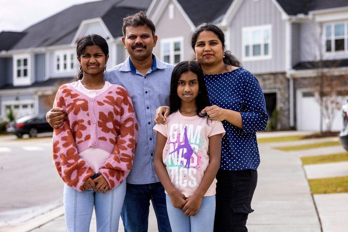 Maharajan Shunmugam and Archana Gopal with their daughters Arshitha Maharajan, 12, and Anshika Maharajan Shunmugam, 9, at their Morrisville home Friday, Nov. 11, 2022.
