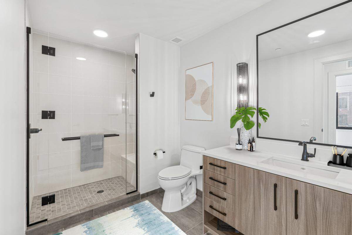 A model bathroom inside The Novus, a glassy high-rise at 400 W. Main St. in Durham’s Five Points district.