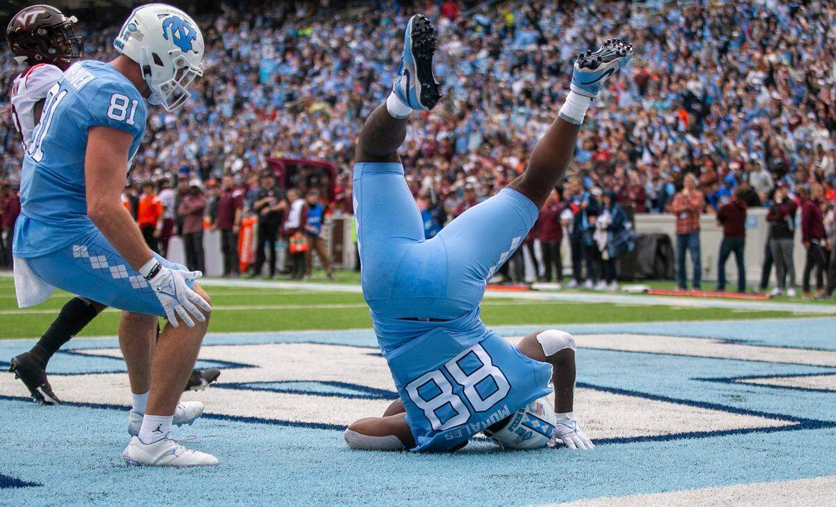 North Carolina’s Kamari Morales (88) scores on a three-yard reception from quarterback Drake Maye (10) to give the Tar Heels’ a 7-3 lead over Virginia Tech on Saturday, October 1, 2022 at Kenan Stadium in Chapel Hill, N.C.
