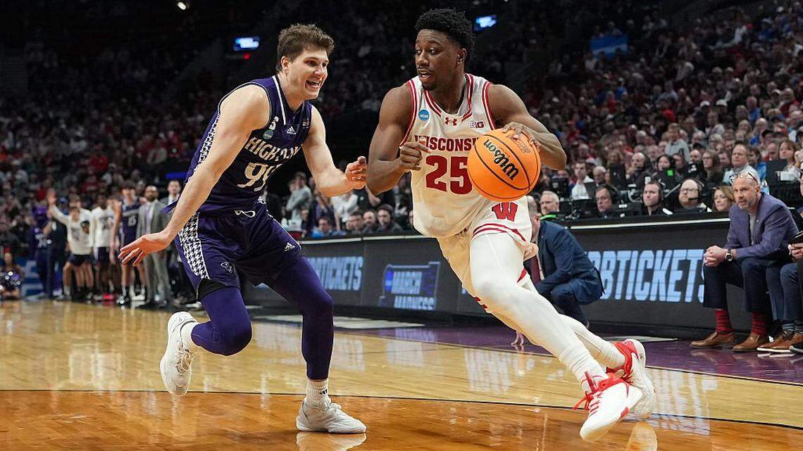 PORTLAND, OREGON - MARCH 19: John Blackwell #25 of the Wisconsin Badgers drives against Chase Johnston #99 of the High Point Panthers during the second half in the first round of the 2026 NCAA Men's Basketball Tournament at Moda Center on March 19, 2026 in Portland, Oregon. The Panthers won 83-82 in regulation. (Photo by Soobum Im/Getty Images)
