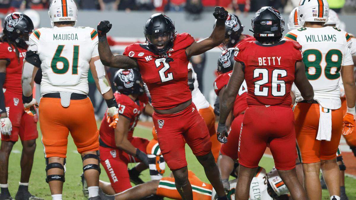 N.C. State linebacker Jaylon Scott (2) celebrates after Miami was stopped on fourth and one in the fourth quarter during the Wolfpack’s 20-6 victory over Miami at Carter-Finley Stadium in Raleigh, N.C., Saturday, Nov. 4, 2023.