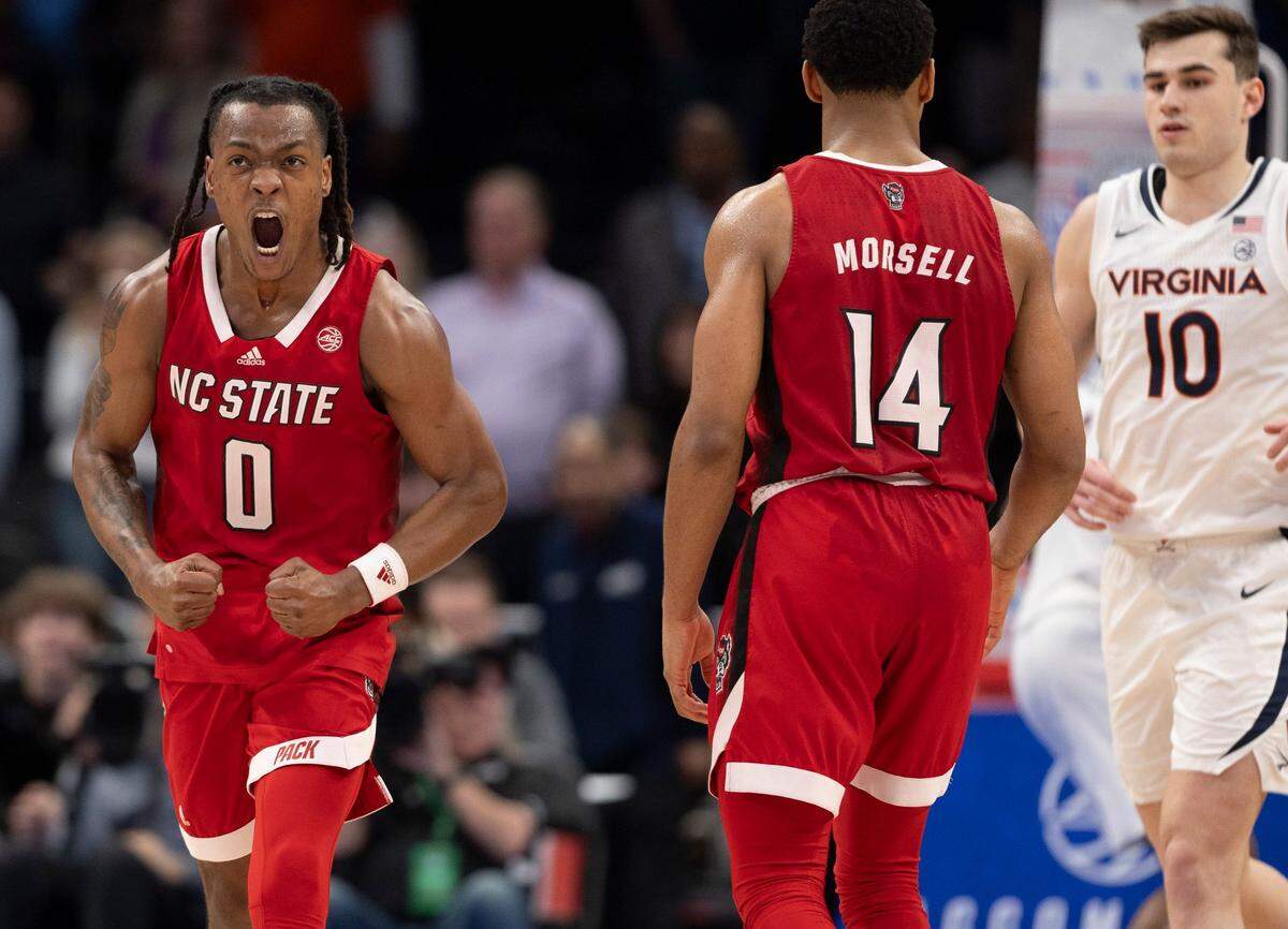 N.C. State’s D.J. Horne (0) reacts after sinking two free throws with ten seconds to play,  to secure the Wolfpack’s 73-65 overtime victory over Virginia in the semi-finals of the ACC Men’s Basketball Tournament at Capitol One Arena on Friday, March 15, 2024 in Washington, D.C.