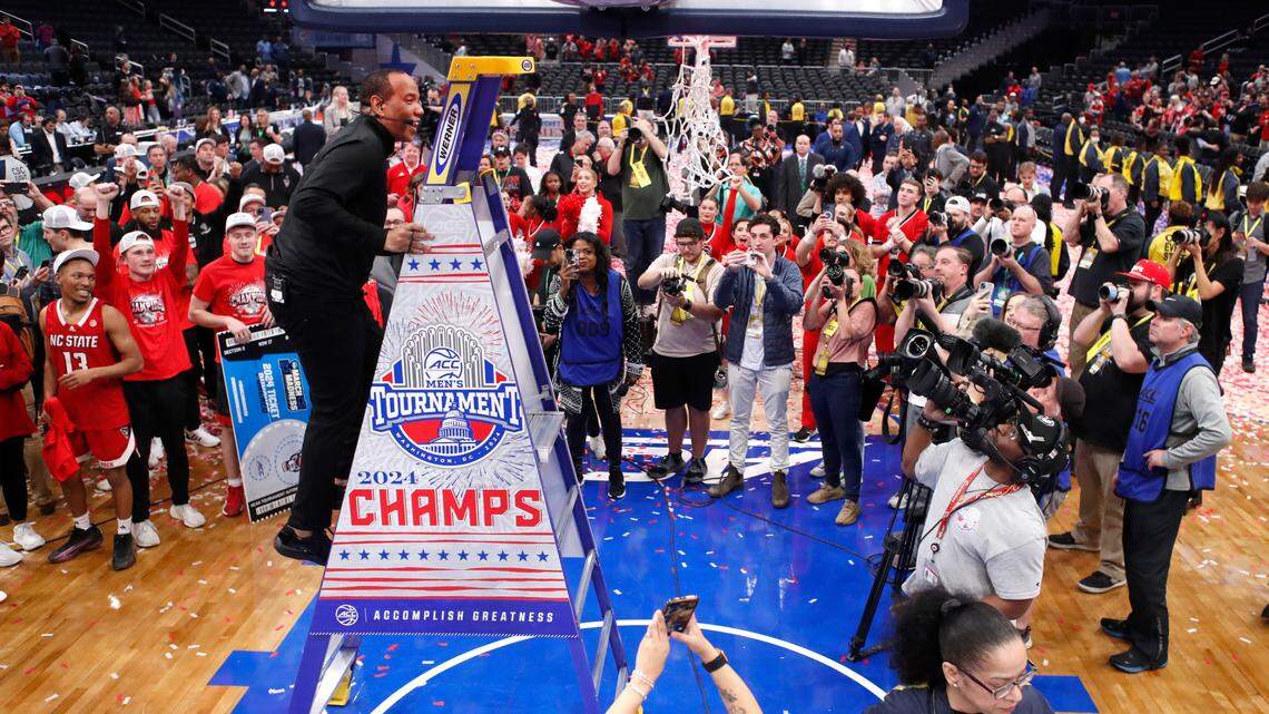 N.C. State head coach Kevin Keatts heads up the ladder to cut down the net after N.C. State’s 84-76 victory over UNC in the championship game of the 2024 ACC Men’s Basketball Tournament at Capital One Arena in Washington, D.C., Saturday, March 16, 2024.