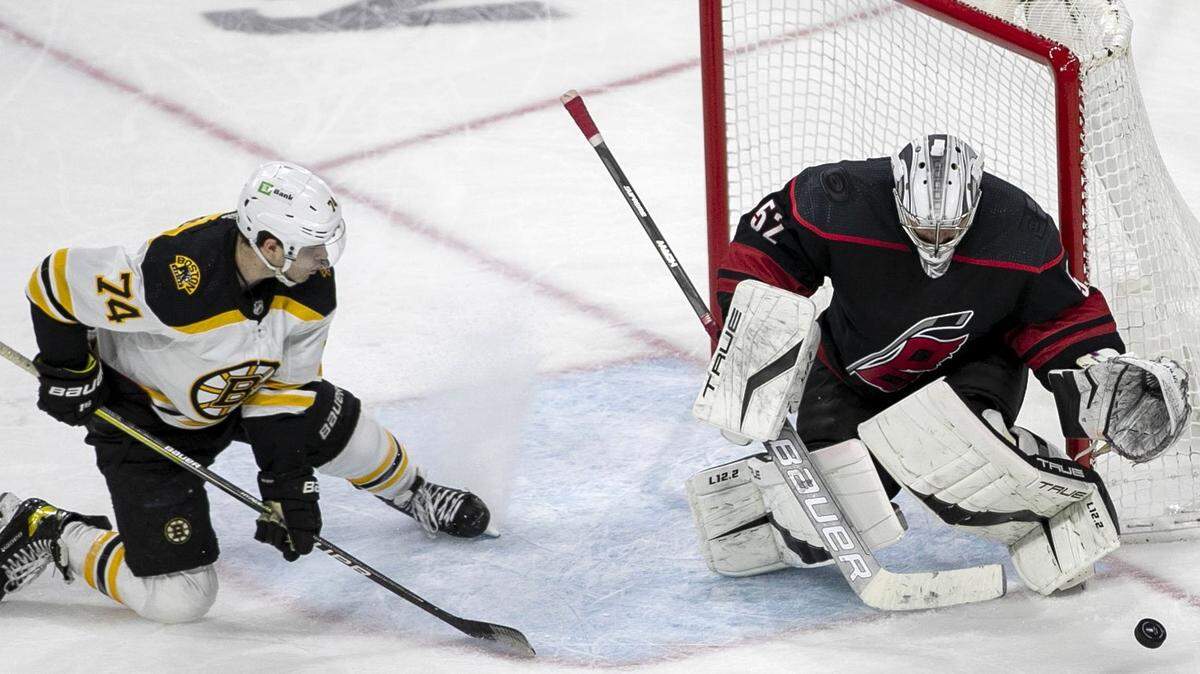 Carolina Hurricanes goalie Pyotr Kochetkov deflects a shot attempt by Bostons Jake DeBrusk (74) in the third period on Wednesday, May 4, 2022 during game two of their Stanley Cup first round series at PNC Arena in Raleigh, N.C.
