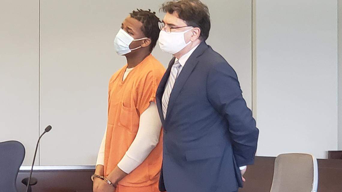 Dominick Jackson, left, stands next to his attorney Alex Charns on Thursday, April 15, 2021, in a Durham County Superior Court hearing in which Jackson pleaded guilty to killing his grandfather William Evans in June 2015.