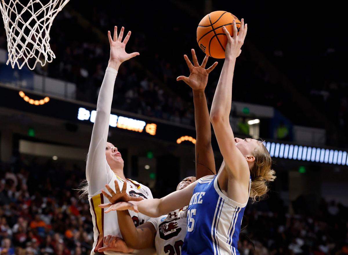 Duke’s Toby Fournier shoots over South Carolina’s Chloe Kitts and Sania Feagin during the second half of the Blue Devils’ 54-50 loss in the NCAA Tournament Elite Eight at Legacy Arena on Sunday, March 30, 2025, in Birmingham, Ala.