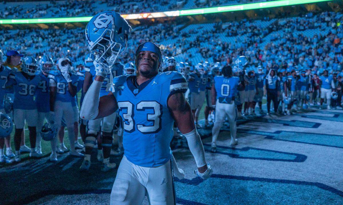 North Carolina’s Cedric Grey (33) celebrates the Tar Heels’ 41-31 victory over Miami with teammates on Saturday, October 14, 2023 at Kenan Stadium in Chapel Hill, N.C.