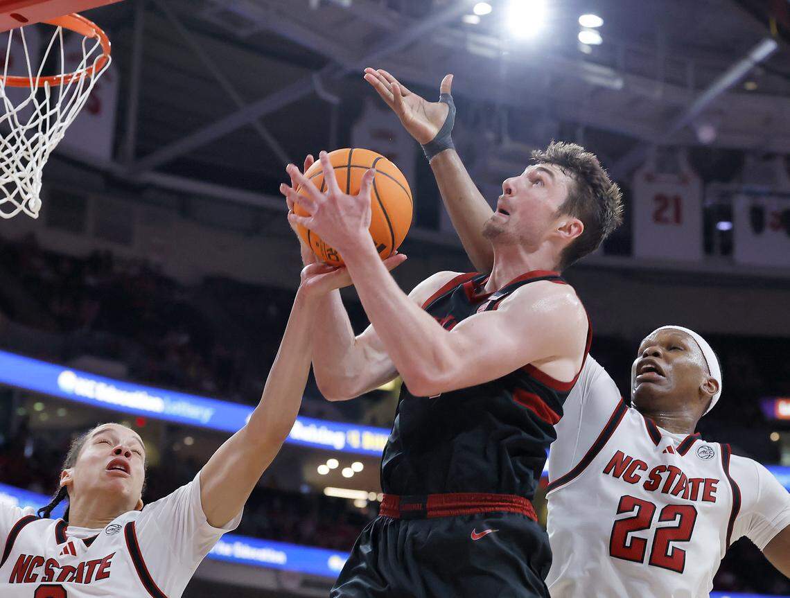 N.C. State's Matt Able and Ven-Allen Lubin battle Stanford's AJ Rohosy for a rebound during the second half of the Wolfpack’s 85-84 loss on Saturday, March 7, 2026, at Lenovo Center in Raleigh, N.C.