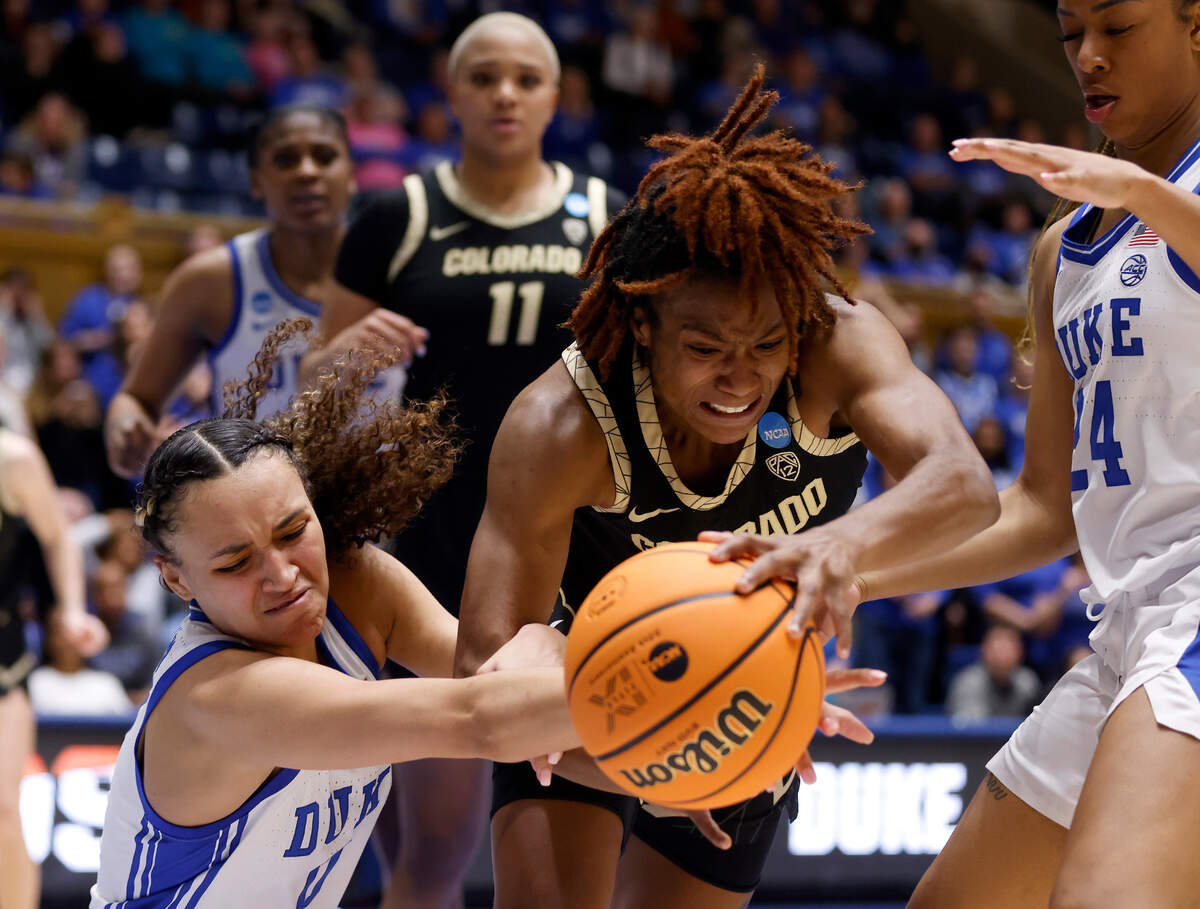Duke’s Celeste Taylor and Reigan Richardson scramble for possession with Colorado’s Jaylyn Sherrod during overtime of the Blue Devils’ 61-53 loss to Colorado in an NCAA Tournament second round game at Cameron Indoor Stadium on Monday, March 20, 2023, in Durham, N.C.
