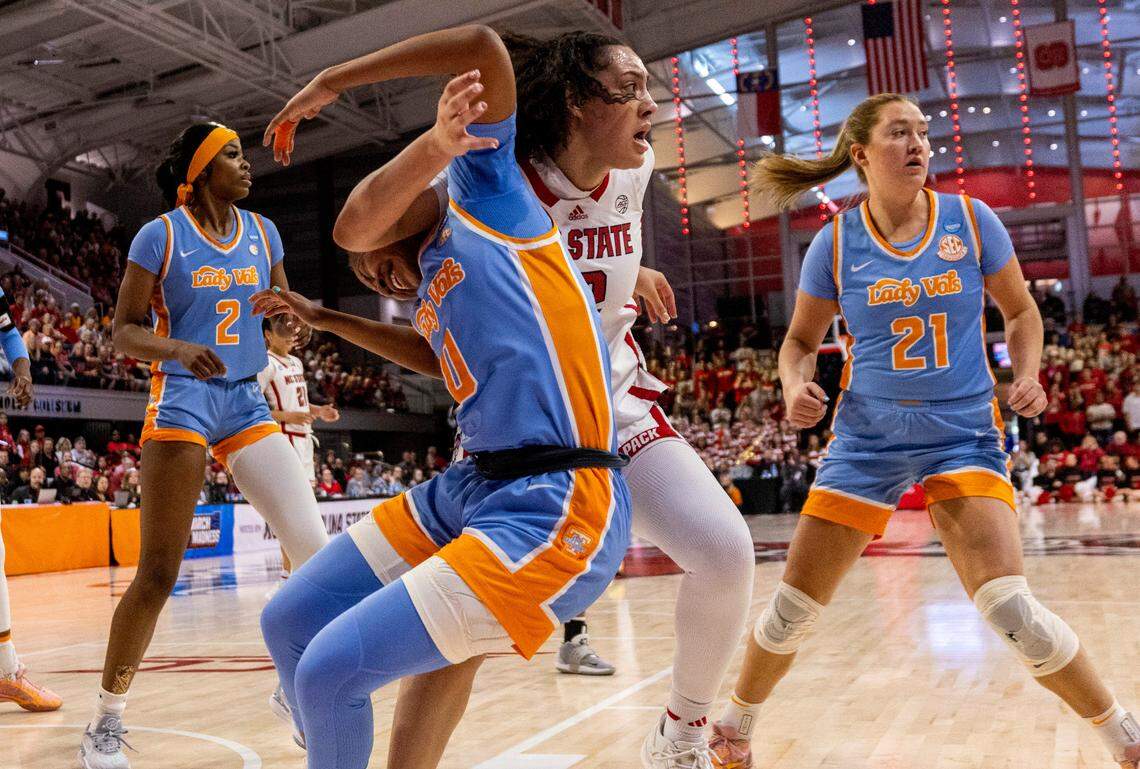 NC State’s Mimi Collins (2) gets tangled up with Tennessee’s Jewel Spear (0) during the first half of the second round of the Division I Women’s Basketball Championship at Reynolds Coliseum in Raleigh, North Carolina, on March 25, 2024.