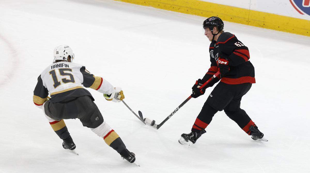 Vegas’ Noah Hanifin (15) breaks up the shot by Carolina's Jackson Blake (53) in the first period of the Hurricanes’ game against the Golden Knights in the first game of the Stanley Cup Final at the Lenovo Center in Raleigh, N.C., Tuesday, June 2, 2026.