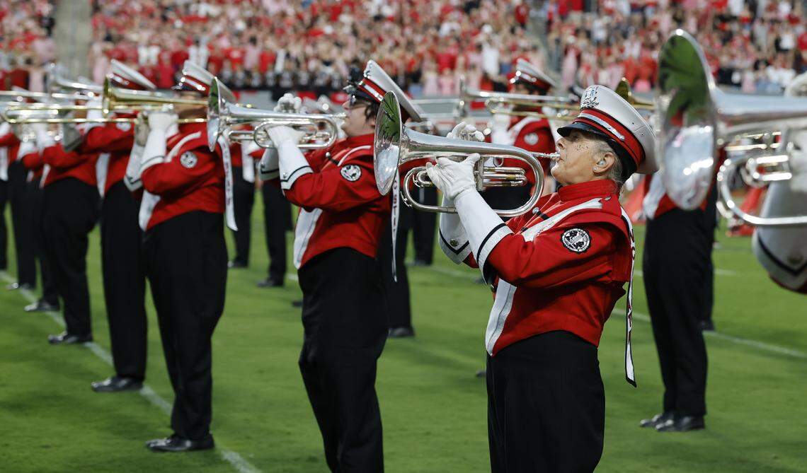 N.C. State Marching Band member Lois Roegge plays the mellophone with the band on the field before N.C. State’s game against Virginia Tech at Carter-Finley Stadium in Raleigh, N.C., Saturday, Sept. 27, 2025.