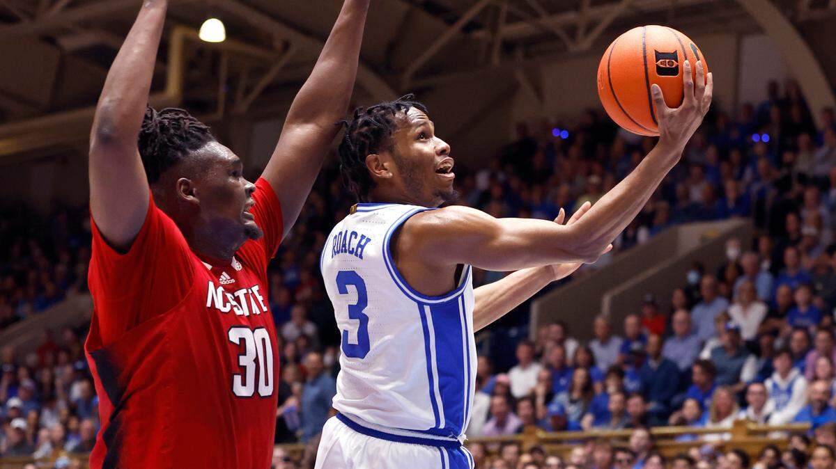 Duke’s Jeremy Roach (3) drives to the basket past N.C. State’s D.J. Burns Jr. (30) during the first half of N.C. State’s game against Duke at Cameron Indoor Stadium in Durham, N.C., Tuesday, Feb. 28, 2023.