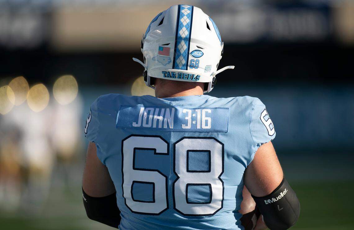 North Carolina’s Brian Anderson (68) has replaced the name on the back of his game jersey with a scripture verse on Saturday, November 27, 2020 at Kenan Stadium in Chapel Hill, N.C. Several players have done the same, choosing other messages for this particular game.