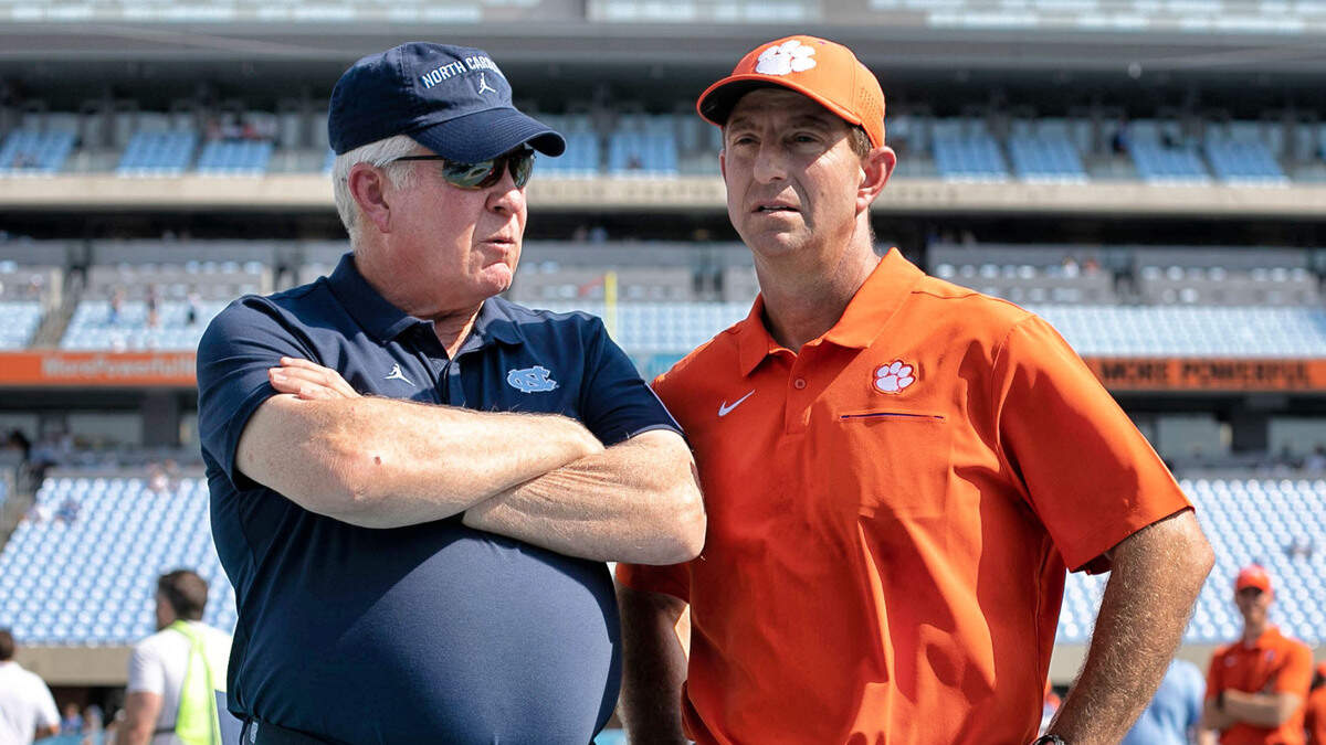 Clemson head coach Dabo Swinney chats with North Carolina coach Mack Brown prior to their game on Saturday, September 28, 2019 at Kenan Stadium in Chapel Hill, N.C.