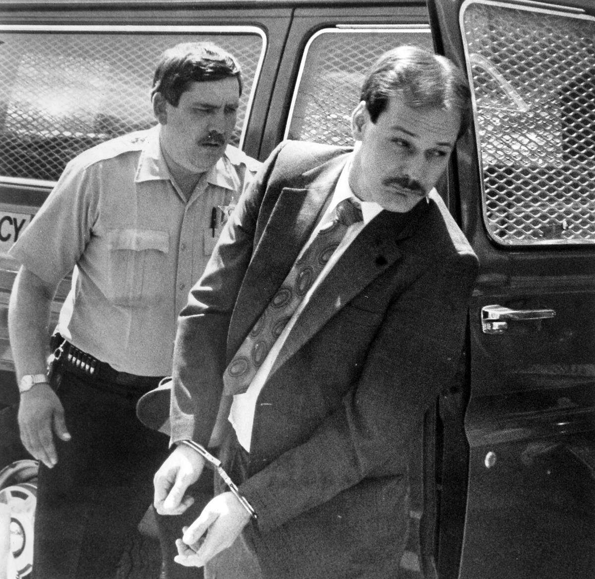 Randall Jolly is escorted into the Orange County court by an unidentified deputy. Randall Jolly is on trial for the murder of his wife Dawn Jolly from a April 1990 Burlington Time-News file photo.