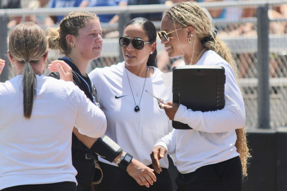 Duke head coach Marissa Young, center, and assistant pitching coach Jala Wright speaks with pitcher Cassidy Curd during the Blue Devils’ NCAA Tournament regional game against Arizona at Smith Family Stadium in Durham, NC, on May 16, 2026.