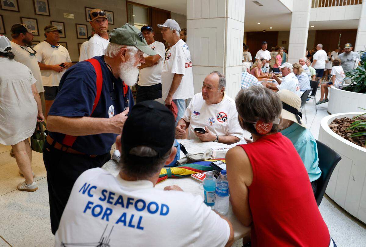 Shrimpers and their supporters gather at the N.C. State Legislature Tuesday, June 24, 2025, to protest House Bill 442, which bans commercial shrimp trawling in inshore waters, including sounds.