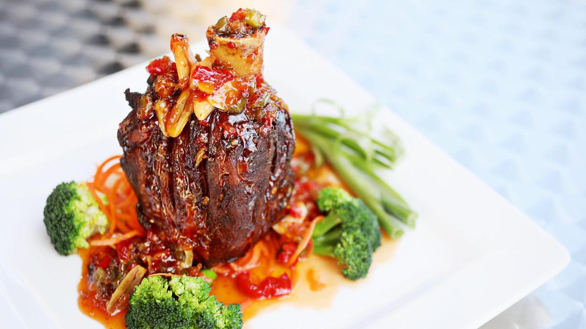Thai 54 owner/chef Vimon Thongruck’s Asian-accented riff on osso buco  — bone-in pork shank, succulent beneath a crisp exterior and a vibrant glaze of a spicy sweet and sour sauce —  leaves no doubt that she is as creative as she is talented.