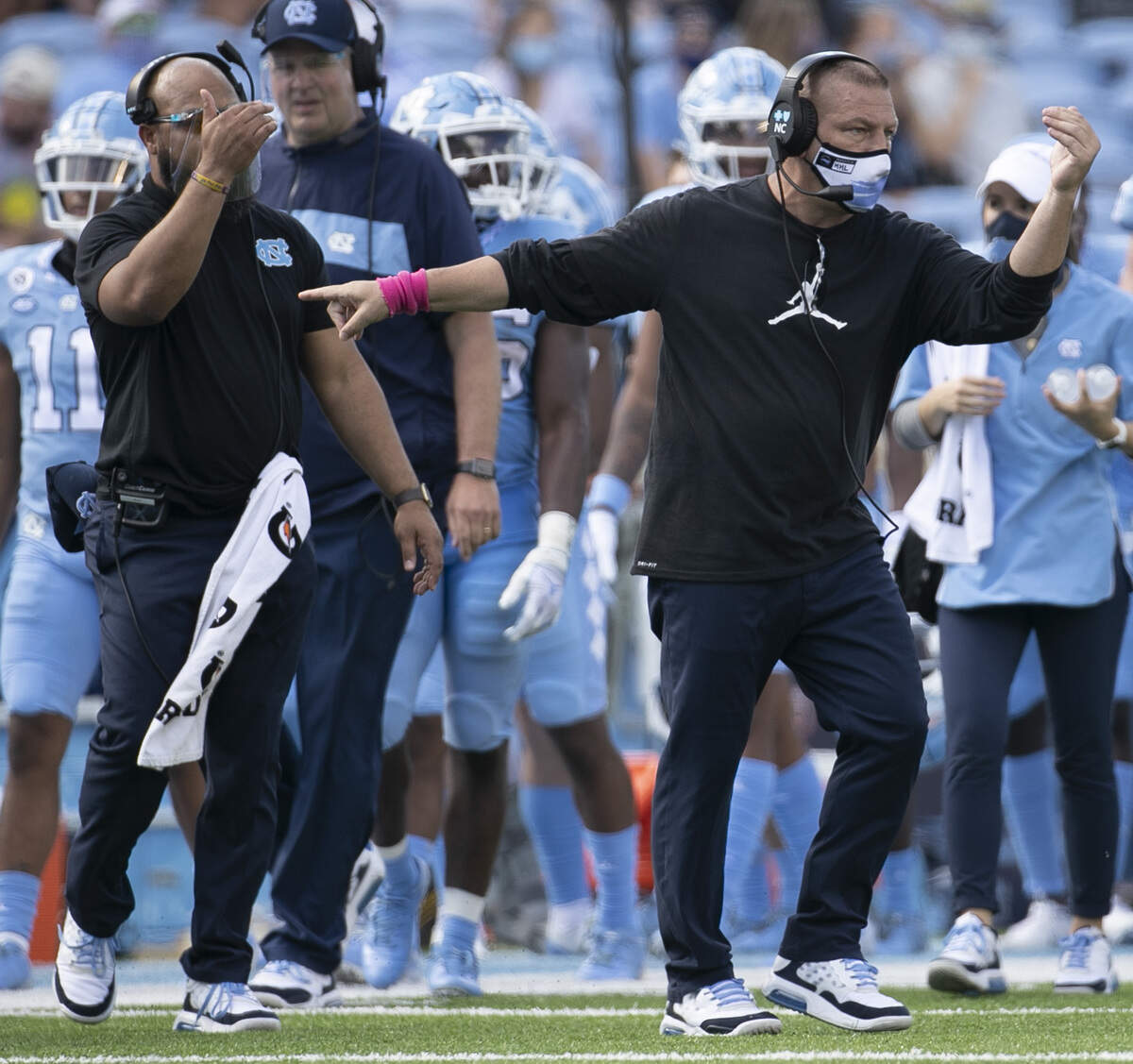 North Carolina offensive coordinator Phil Longo directs his players in the second quarter against N.C. State at Kenan Stadium on Saturday, October 24, 2020 in Chapel Hill, N.C.